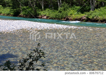 The Azusa River in Kamikochi, a highland valley inside the Chubu-Sangaku National Park in the Hida Mountains range of the northern Japanese Alps in Nagano Prefecture, Japan. The Azusa River in Kamikochi, a highland valley inside the Chubu-Sangaku National Park in the Hida Mountains range of the northern Japanese Alps in Nagano Prefecture, Japan. 80670712