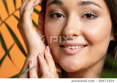 Happy smiling positive plus size woman. Face close-up. Pretty caucasian female model at studio. Concept of beauty, body, skin care Happy smiling positive plus size woman. Face close-up. Pretty caucasian female model at studio. Concept of beauty, body, skin care 80671804