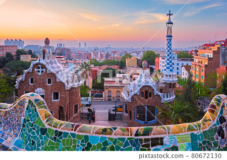 Barcelona city view from Guell Park. Sunrise view of colorful mosaic building in Park Guell Barcelona city view from Guell Park. Sunrise view of colorful mosaic building in Park Guell 80672130