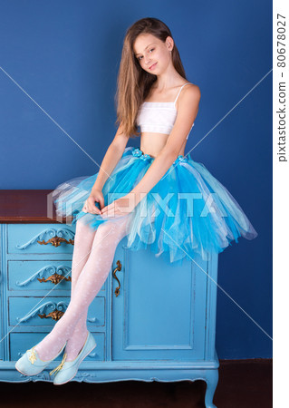 Teenage girl wearing ballet tutu skirt. Young ballerina dancer. 80678027