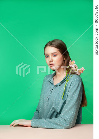 Young female model with flowers in pocket Young female model with flowers in pocket 80678566