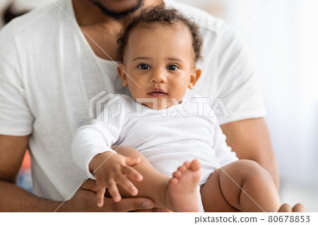 Child Care. Closeup Of Cute Little Black Infant Baby In Father's Hands 80678853