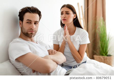 Wife Pleading Offended Husband To Forgive Her Affair In Bedroom Wife Pleading Offended Husband To Forgive Her Affair In Bedroom 80679051