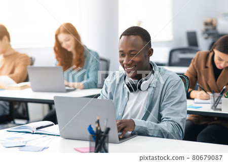 Group of international people using laptops in classroom Group of international people using laptops in classroom 80679087
