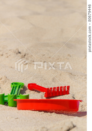 Children toys on sand at beach. Vacation time concept. Place for inscription 80679446