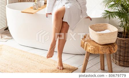 Woman Sitting On Bathtub Caring For Body Indoor, Cropped, Panorama 80679779
