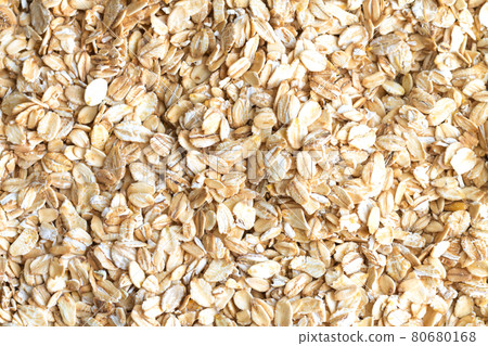 Heap of dry raw rolled oat flakes Heap of dry raw rolled oat flakes 80680168