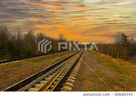 Beautiful scenic sunset on the background of the railway. Beautiful scenic sunset on the background of the railway. 80680343