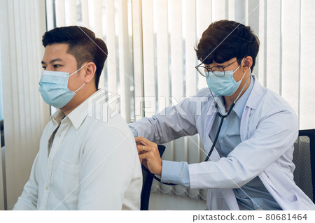 Asian doctor is using a stethoscope listen to the heartbeat of the patient. Asian doctor is using a stethoscope listen to the heartbeat of the patient. 80681464