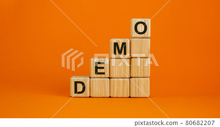 Wood cubes with word 'demo' stacking as step stair on beautiful orange background, copy space. Business concept. 80682207
