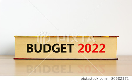 Budget planning 2022 new year symbol. Concept words 'Budget 2022' on book on wooden table. Beautiful white background. Business, budget planning 2022 new year concept. Budget planning 2022 new year symbol. Concept words 'Budget 2022' on book on wooden table. Beautiful white background. Business, budget planning 2022 new year concept. 80682371