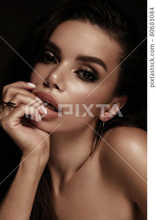 Beautiful girl with bright fashionable make-up and unusual gold accessories. Beauty face. 80683084