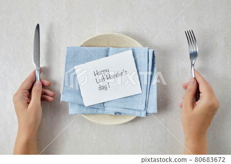Happy Lefthanders Day, for August 13 with table setting showing reverse cutlery placing. 80683672