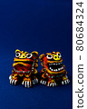 Orange shisa with blue background 80684324