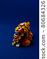 Orange shisa with blue background 80684326