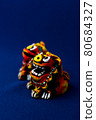 Orange shisa with blue background 80684327