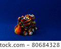Orange shisa with blue background 80684328