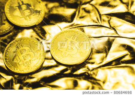 Golden bitcoin Coins on a golden background. Trading on the cryptocurrency exchange. Cryptocurrency Stock Market Concept. Virtual money concept. Mining or blockchain technology. Business concept. 80684698