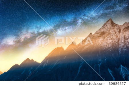 Milky Way and snowy mountains at starry night. Landscape Milky Way and snowy mountains at starry night. Landscape 80684857