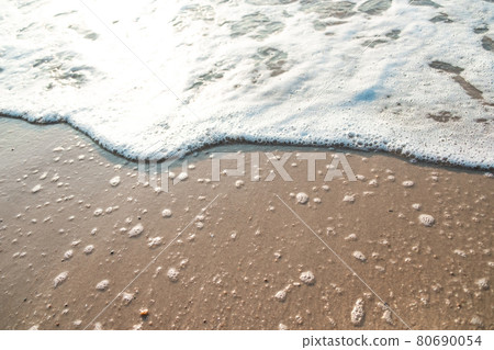 Close Up Wave Sand Beach Sea Foam.  Closeup of sea wave with foam on beach sand. Vacation Summer background 80690054