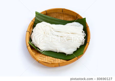 Rice noodle in bamboo basket on white background. Rice noodle in bamboo basket on white background. 80690127