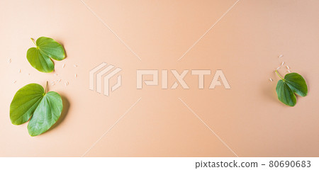 Happy Dussehra. Green leaf on orange pastel background. Dussehra Indian Festival concept. Happy Dussehra. Green leaf on orange pastel background. Dussehra Indian Festival concept. 80690683