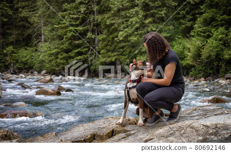 Woman hiking with Boxer Dog in the Canadian Nature 80692146