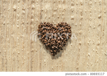 Coffee beans top flat view of heart shaped cafe background coffee lover concept on rustic bag texture 80693117