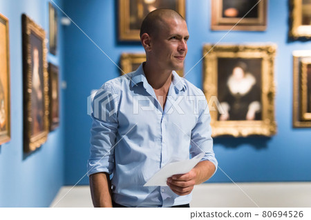 Portrait of man in gallery Portrait of man in gallery 80694526