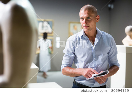 Adult man in museum Adult man in museum 80694559
