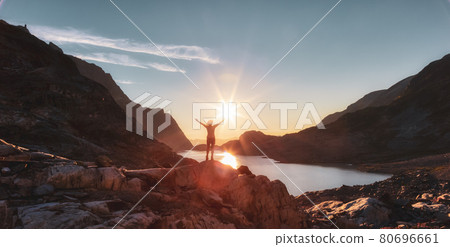 Adventurous Caucasian Adult Woman Hiking on top of a Canadian Rocky Mountain 80696661