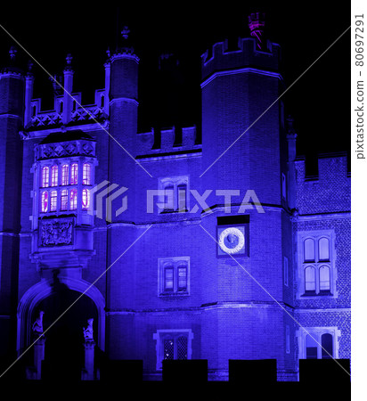 Illuminated Hampton Court Palace by night 80697291
