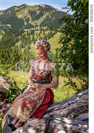 Romantic traditional costume fashion in the Bavarian Alps. Romantic traditional costume fashion in the Bavarian Alps. 80698026