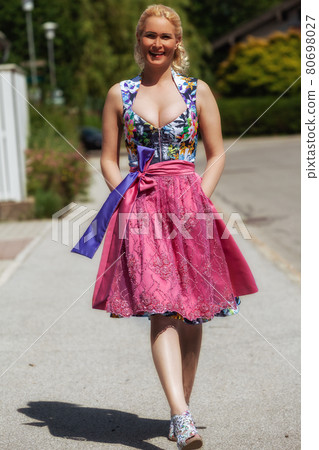 Summer mood in colorful dirndl Summer mood in colorful dirndl 80698027