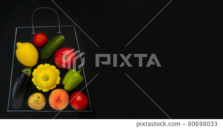 A grocery bag chalk drawn on black background filled with vegetables and fruits A grocery bag chalk drawn on black background filled with vegetables and fruits 80698033