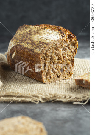 Square artisan sourdough rye bread on dark background. /wild yeast, rustic, artisan loaf. Square artisan sourdough rye bread on dark background. /wild yeast, rustic, artisan loaf. 80698229