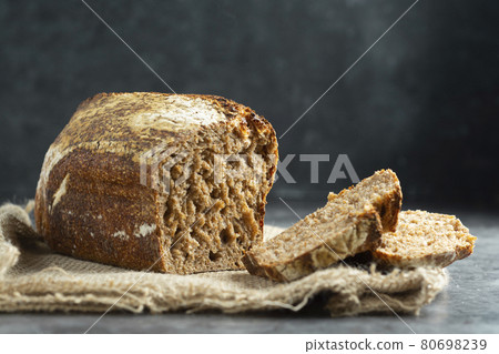 Square artisan sourdough rye bread on dark background. /wild yeast, rustic, artisan loaf. Square artisan sourdough rye bread on dark background. /wild yeast, rustic, artisan loaf. 80698239