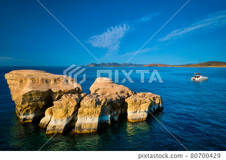 Yacht boat at Sarakiniko Beach in Aegean sea, Milos island , Greece 80700429