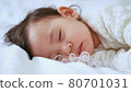 close up portrait of beautiful sleeping baby girl, 1 year old, mixed race kid, half Thai half Romanian, soft focus 80701031