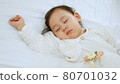 portrait of beautiful sleeping baby girl, 1 year old, mixed race kid, half Thai half Romanian, soft focus 80701032