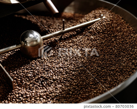 Cooling tray with brown roasted coffee beans Cooling tray with brown roasted coffee beans 80703036