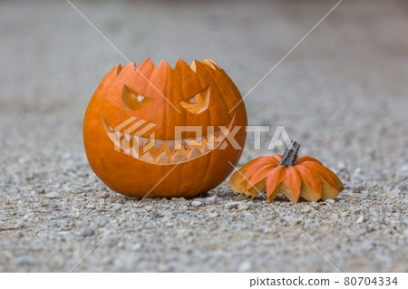Scary smiling halloween pumpkin nasty face ground 80704334