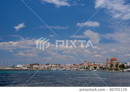 Clear waters of Mediterranean sea and a beautiful view of Aegina town in Aegina island, Saronic gulf, Greece. Clear waters of Mediterranean sea and a beautiful view of Aegina town in Aegina island, Saronic gulf, Greece. 80705139