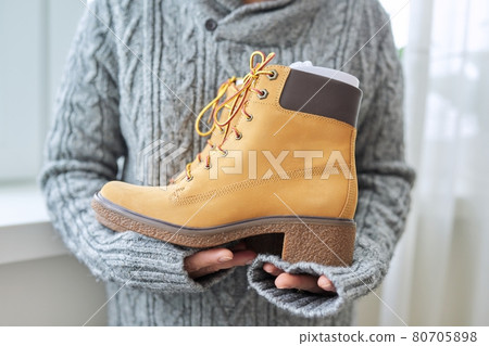 New womens leather brown waterproof hiking winter autumn boots in hands of female 80705898