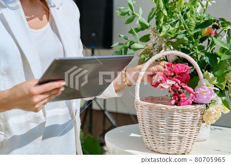 Organization of weddings, parties, event decoration. Female with basket with rose petals 80705965