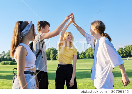 Meeting of teenage friends. Group of cheerful happy teenagers 80706545