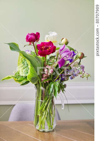 Bouquet of bright flowers on the table in jug Bouquet of bright flowers on the table in jug 80707989