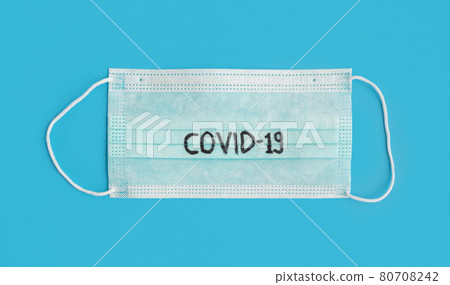 Face mask isolated on blue background. Face covering. Virus protection. Medical and healthcare. Coronavirus covid-19 outbreak. 80708242