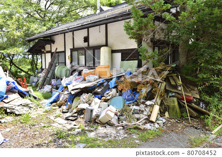Garbage mansion. A pile of garbage illegally dumped in an unoccupied house. 80708452