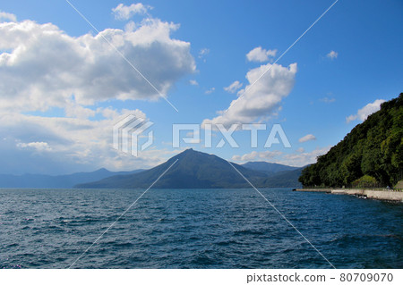 Overlooking Lake Shikotsu, the active volcano behind it, and Mt. Eniwa. Overlooking Lake Shikotsu, the active volcano behind it, and Mt. Eniwa. 80709070